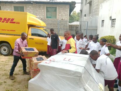 A DHL delivery from the UK arrives at the school