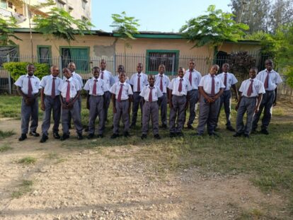 The boy students at Bombolulu Educational Centre showing off their new uniforms