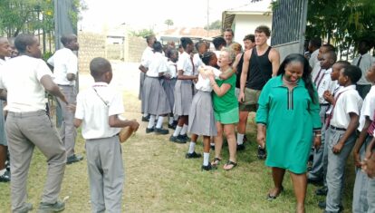 Nicola and family arrive at the school and are greeted warmly by the Bombolulu students
