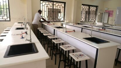 The science lab all ready for use, rows of lab units and stools
