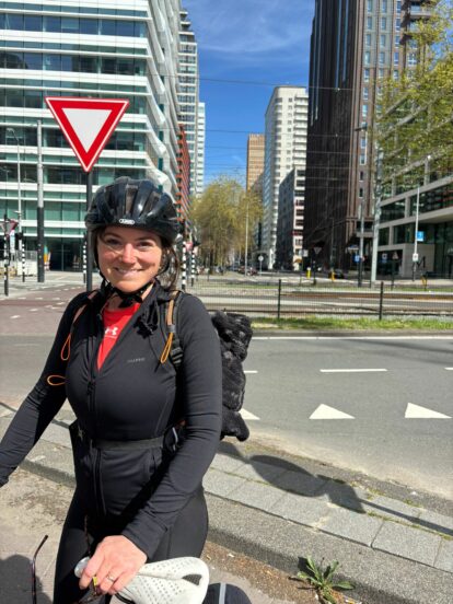 Amelia from DTRE with her bike in a city