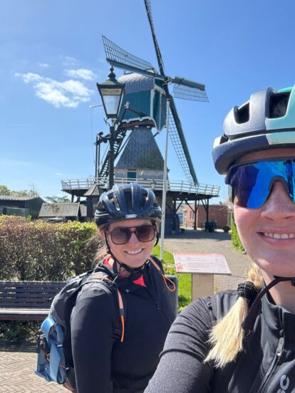 The two intrepid lady cyclists from DTRE in Holland with a windmill in the background