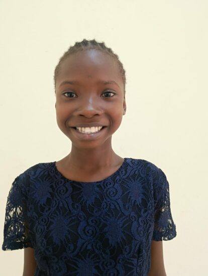 One of our 2026 student intake, a headshot of Magret, with a big smile