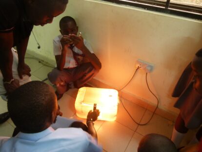 Students on the floor as they test their incubator innovation