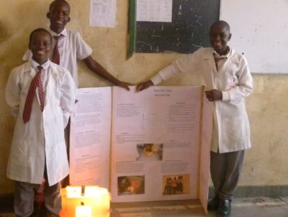 Three students from Bombolulu Educational Centre showcase their poultry egg incubator at the science show