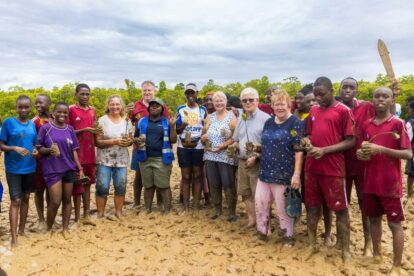 The visitors covered in mud after planting mangroves