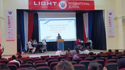 One of our students on stage debating a very topical subject