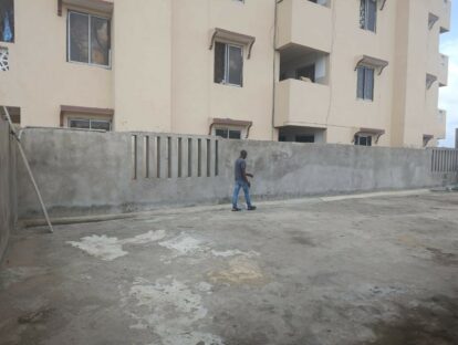 The unfinished school roof showing how close apartment blocks are to the top of the school