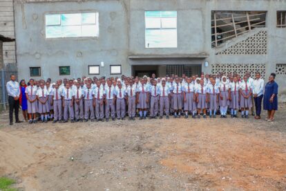 All the students and staff outside the school before it was decorated